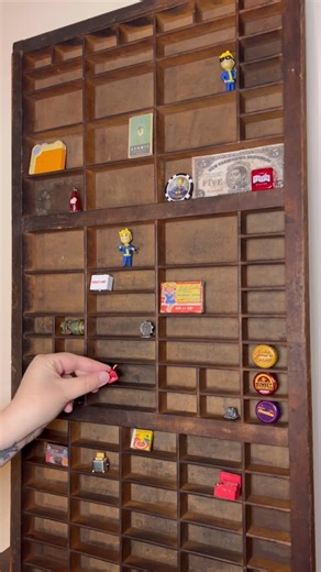 Mrs.Fallout👩‍🔧 on Instagram: "Day 4 of filling my Fallout antique printers tray shelf! The progress continues on this Fallout project and im getting more excited the further along we get! What should I put on next?? I found this printers tray as a thrift store and wanted to make a Fallout minitures display shelf with it! I hope you will join me as I’ll be updating with short videos as I go! Next video in a week or 2 :) #minitures #thrifting #printerstray #thriftstore #vaulttec #1950s #fallout 