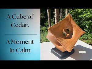 The Beauty of Cedar: Hand-Carved Wooden Cube Sculpture in Natural Light