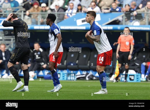Hamburg, Deutschland. 04th Apr, 2026. 2026.04.04 xfsx Fussball 1. Bundesliga Hamburger Sportverein - FC Augsburg v.l. Michael Gregoritsch (38, FC Augsburg), Albert Lokonga (Hamburger SV, 6), Luka Vuskovic (Hamburger SV, 44) (DFL regulations prohibit any use of photographs as image sequences and/or quasi-video. (Photo by HMB Media/Fernando Soares/Sipa USA) Credit: Sipa US/Alamy Live News Stock Photo - Alamy