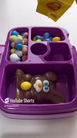 Packing school lunch with chocolate bunny treat