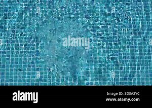 Mesmerizing patterns on the water surface, shimmering blue reflections and ripples in the pool