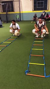 One of our favorite warm up drills!! Ladder pitch calls to pop. Here’s the focus: ✅We keep a LOW TARGET for our pitchers ✅We keep our pitch call position TIGHT with feet inside the ladder and glove next to the knee ✅We stay BALANCED as we move from our pitch calling into a ready position with feet outside the ladder ✅ We WORK HARD all the way through the end of the ladder Let us know if you try this in your next workout! | Jen Schro Catching
