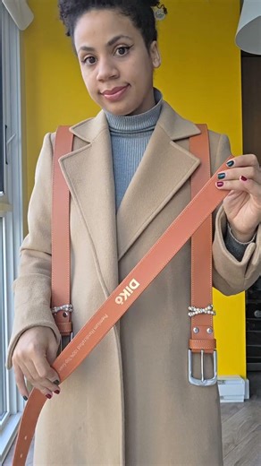 How to wear a harness without looking weird: 3 belts and a coat.