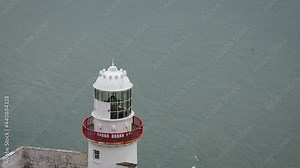Lighthouse Beacon Rotating in Lantern Room Above the Sea