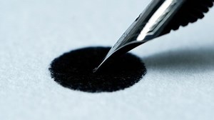 clip-1066399111-ink-fountain-pen-spreading-on-white-paper