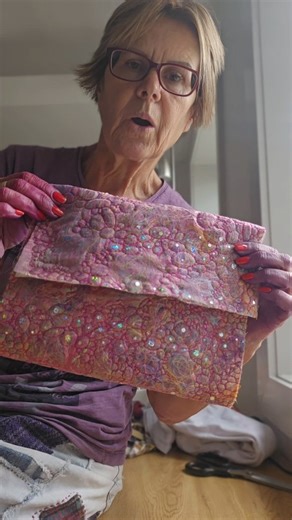 I'm upcycling threads, old threads, pretty threads, just plain sewing threads into a pouch. I've literally dropped the threads onto a piece of fabric, put a sparkly organza over the top, added some batting underneath and sewed all different sized circles, using free motion on my sewing machine. #freemotionquilting #fabricscraps #slowfashion | Upcycled Artistry