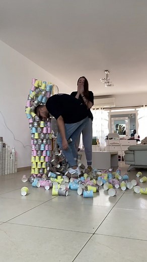 Creative Cup Stacking Challenge in Living Room