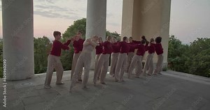 Modern interpretive dance by young people in a temple in the early morning, 4k