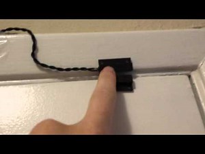 How do alarm system door switches work?