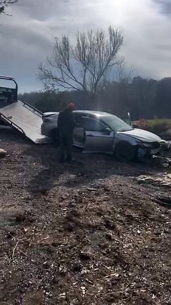 Car being towed away after crashing in river #scuba #tow #truck #winch #carshow #mystery #crazy | Adam Brown Adventures