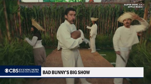 Bad Bunny, the 31-year-old Puerto Rican superstar, performed hits from his Grammy-winning album "DeBÍ TiRAR MáS FOToS" during the Super Bowl halftime show, paying tribute to his homeland. https://cbsn.ws/4rbAZCv | CBS Evening News