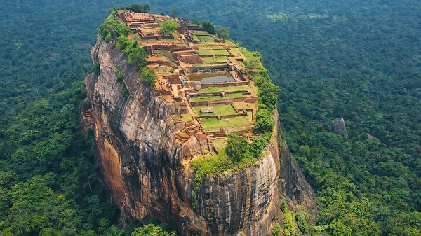 Ancient ruins on top of a giant rock
