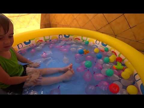100 WATER BALLOONS IN THE POOL!! Challenge Bunch o Balloon for Kids with Maikito