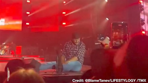 Musician Luke Bryan slipped and fell in the middle of his concert in Vancouver, Canada, on Saturday. After the fall, Bryan appeared to be in good spirits, laughing at himself and holding up a cell phone, seemingly blaming the slip on the object. | Breitbart