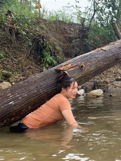 Transporting timber alone on rural river channels | Robiul Islam