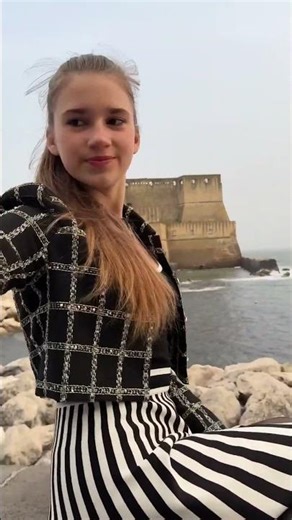 Karolina Protsenko (15 yrs) - Posing with a view of Castel Nuovo in Naples, Italy (Mar 31, 2024)