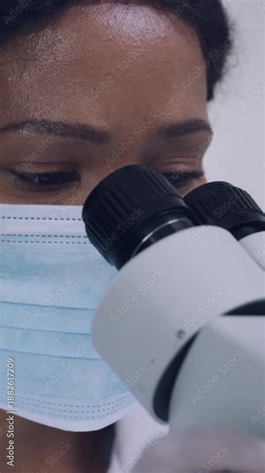 Scientist, medical research and woman with microscope, lab and analysis of cancer cells with sample. Healthcare, pathology and person with equipment for disease diagnosis and biotechnology for cure