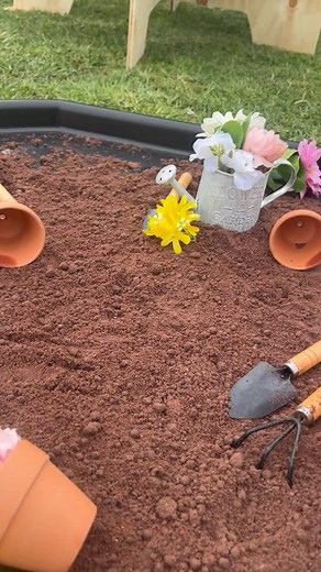 Wildflower theme for a 2nd birthday party! The setup included 5 sensory stations featuring play dirt, jelly, rice, magic water and play dough. Each station taste safe and sparking imaginative play! | Curious Cub Co