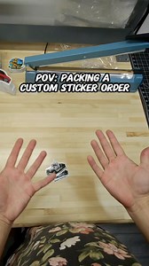 Packing a custom cartoon sticker order. Outdoor rated stickers with a uv laminate. Size 3”x3” #packingorders #smallbusiness #behindthescenes #pov | AADesigns.co