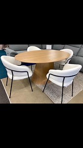 Contemporary Scandi Style & on trend Oval Dining Table, natural light oak woodgrain effect, with contoured styling, & 4 Luxurious art deco style ivory bouclé chairs, with black frame and ribbed, contoured design- Now £399 Surplus Stock Prudhoe NE42 6HD- Call Us 01661 836717 #scandistyledining #contemporarydining | Surplus Stock & Factory Fabrics NE42 6HD