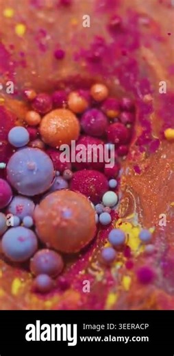 Vertical video. Acrylic paint. Flow mix. Defocused orange purple blue color oil pigment glitter water bubbles wet particles on abstract background Stock Video Footage - Alamy