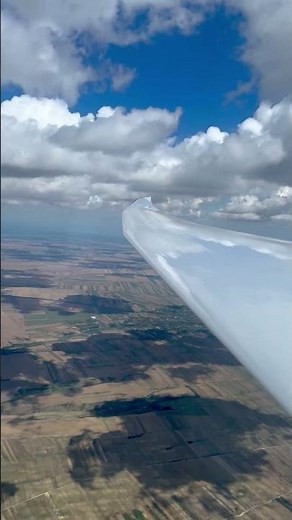 Glider Cockpit View Flying Side by Side Above the Clouds