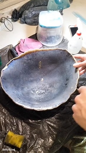 🔥 Raku magic in action 🔥 This bowl came out of the kiln glowing red hot and went straight into sawdust. The smoke slips into every little crack in the glaze and creates that beautiful crackle texture Raku is known for. But it also comes out completely black and sooty. So we scrub. And scrub. And scrub a little more. Worth every bit of elbow grease. The transformation is always the best part. ✨ #RakuCeramics #BellyBowl #HandcraftedArt #PotteryProcess #BehindTheScenes #MakersGonnaMake #ArtInTheM