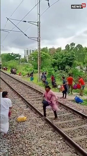 Railway Track Ruckus: Passengers Cross Seconds Before Train's Arrival | #Shorts | #ViralVideo