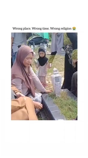 SP on Instagram: "* Detailed Media Description: This clip, filmed at a solemn Muslim cemetery, captures a profound moment of cultural intersection. A young child, clad in a hijab, walks up to a gravestone and innocently announces, “Happy Christmas!” The family’s immediate, suppressed laughter beautifully underscores the universal innocence of youth navigating complex social and religious contexts. * Viral Impact and Audience Reaction: The video, shared by @ViralCurator, exploded with 4.7 million