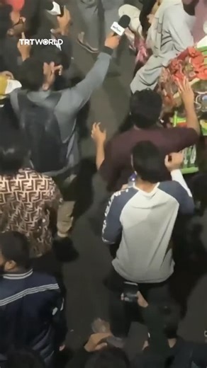 TRT World on Instagram: "Demonstrators filled the streets of Dhaka after Bangladeshi political leader Sharif Osman Hadi died in a Singapore hospital on December 18, 2025. Hadi, a prominent figure in the 2024 student uprising, had been shot in the head days earlier in the capital in an apparent assassination attempt"