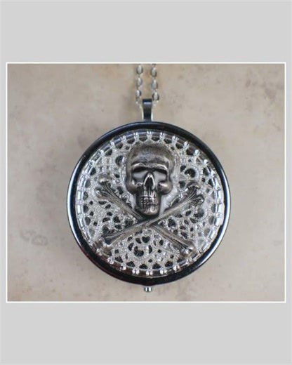 Skull and Crossbones Music Box Locket in Silver