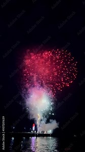 Vertical video of a fireworks show in the ocean