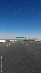 Vertical view of 15 freeway highway sign to Las Vegas in the California Mojave desert.
