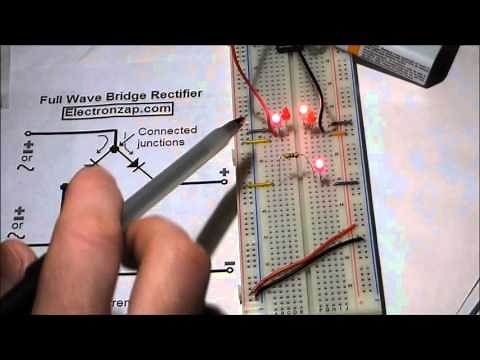 Electronics circuit. Full wave bridge rectifier. LEDs and 1N4001 diodes. Rectifier component shown.