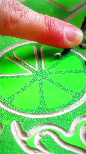 Embossed lime slice pattern gleaming on green surface, crisp rhythm of night decorative craft