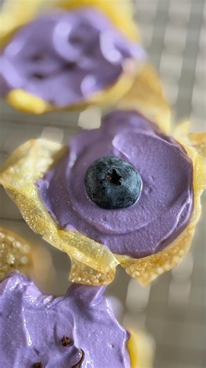 @katlieu teaches us how to make her colorful Rice Paper Yogurt Tarts.😍Perfect for an after-school or mid-day snack! Filled with sweetened Greek yogurt flavored with ube extract and topped with fresh blueberries, these mini tarts are an easy, no-fuss treat. Find the full recipe on tasty.co or in bio! | Tasty