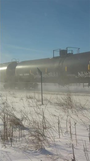 Northbound Union Pacific train with UP 5058 in the snow on the Spine Line