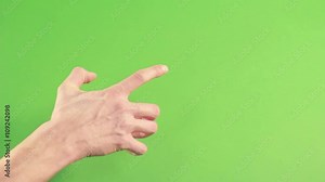Hand isolated on green background. Human hand gesture isolated on green screen. Man hand on chroma key background pointing. Person wrist isolated in green studion