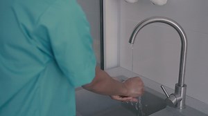 Free stock video - Detail of hand washing by a healthcare professional