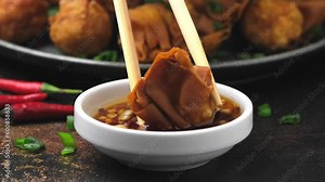 Dipping Fried Wonton with prawn and pork filling in sauce