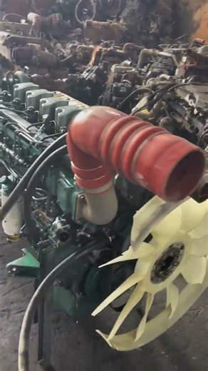 The image shows a diesel engine mounted on a test bench, undergoing a load test (as the capt