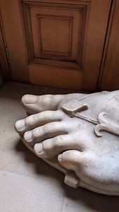 At Chatsworth House in Derbyshire sits a famous colossal marble foot from classical antiquity — a large ancient Greek (or Greek-style) marble foot wearing a sandal, acquired in 1839 by the 6th Duke of Devonshire and long displayed in the house’s sculpture collection. It’s thought to have belonged to a colossal statue of a seated Greek god or goddess that may once have stood around 11 m high, with the exposed marble parts (feet) surviving while the rest of the statue was lost. A matching right fo