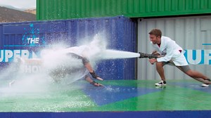 Guy getting blasted by a fire hose in extreme slow-mo is all of us just trying to get through the day