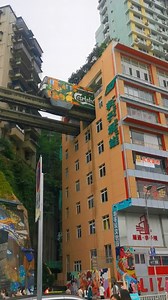 Liziba Monorail Station in southwest China's Chongqing Municipality is well known for the monorail passenger train that runs through a 19-story residential building, which attracts crowds of tourists to wait for passing trains and take photos. #TheNewSilkRoad #SharedFuture10Years #MemoriesEnRoute #Travel | China Plus Culture
