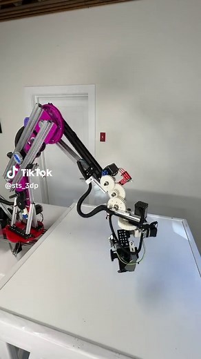 6-axis robot arm. Nearly all the gearing and brackets are 3D printed ABS. The frame/arm is extruded aluminum. Each arm joint is comprised of two tapered rollers bearings (one small, one large) with the driven gear sandwich in between. It uses 3 NEMA 23, and 3 NEMA 17 stepper motors. It’s controlled by an ESP32 microcontroller, which receives commands via WiFi from a computer. The ESP32 has duel-cores: one listens for commands and writes them to a queue while the other core reads from the queue a