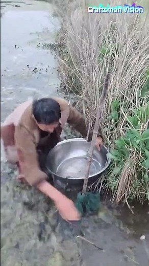 catching crayfish with fishing cages along shallow water ridges