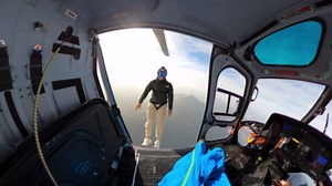 Man jumps from a helicopter over the Alps - and nearly slams into the cliff