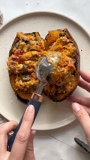 Mex-Style Stuffed Sweet Potatoes, a new dinner fav! Serve with fresh guacamole and some enchilada sauce for a delish dinner. | By The Forkful