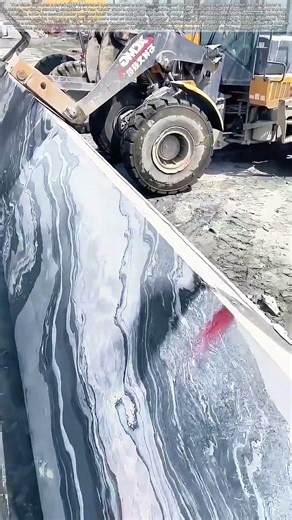 Lowering the Monolith: How Two Loaders Collaborate to Lay a Stone Slab