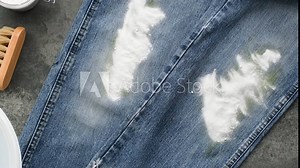 Eco cleaning stubborn stains from jeans fabric at home. Dirty grass stains on jeans Stock Video